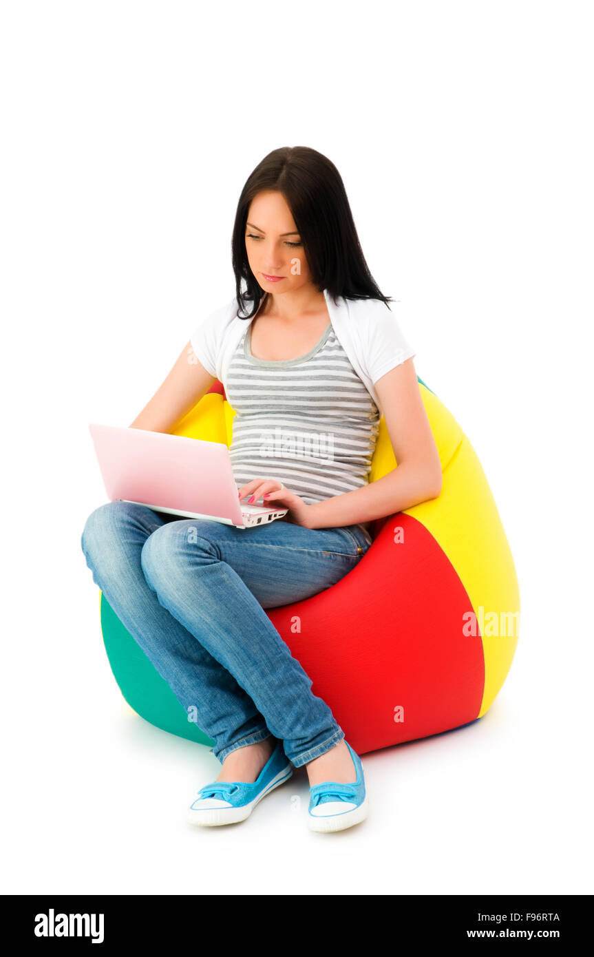 Girl working on laptop isolated on white Stock Photo - Alamy