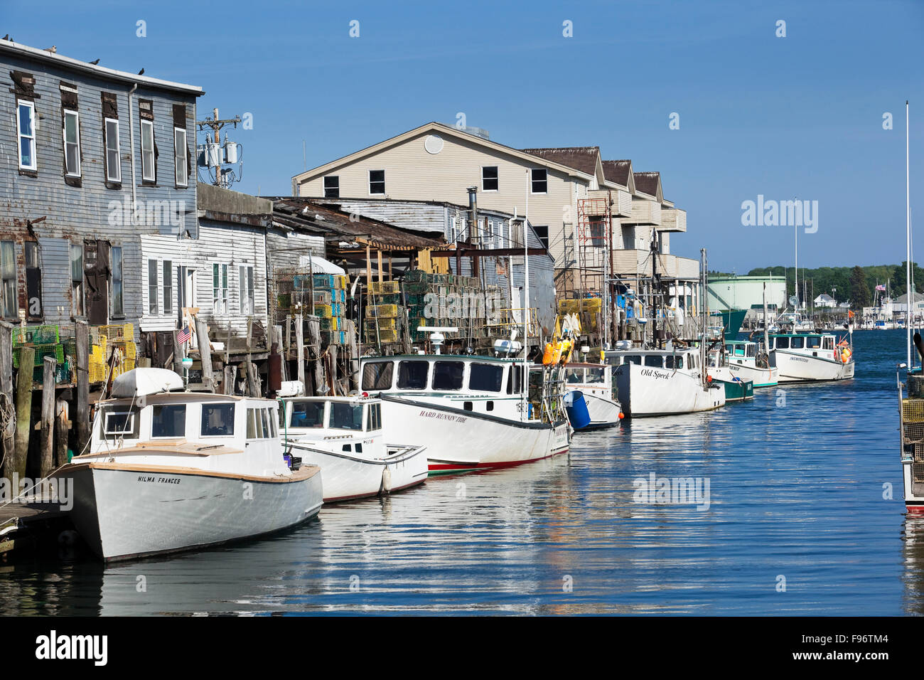 Row of Maine lobster boats tied along the Custom House Warf in Portland