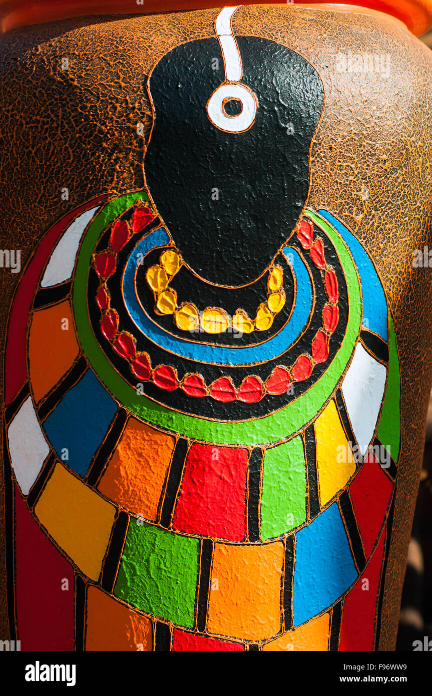 Tribal figure on large garden pot for sale, CBD, Kampala, Uganda Stock Photo