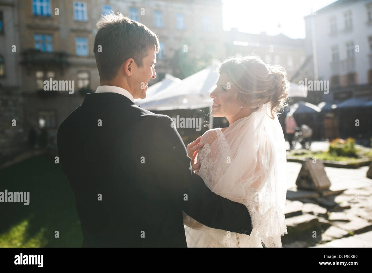bride and groom posing on the streets Stock Photo - Alamy