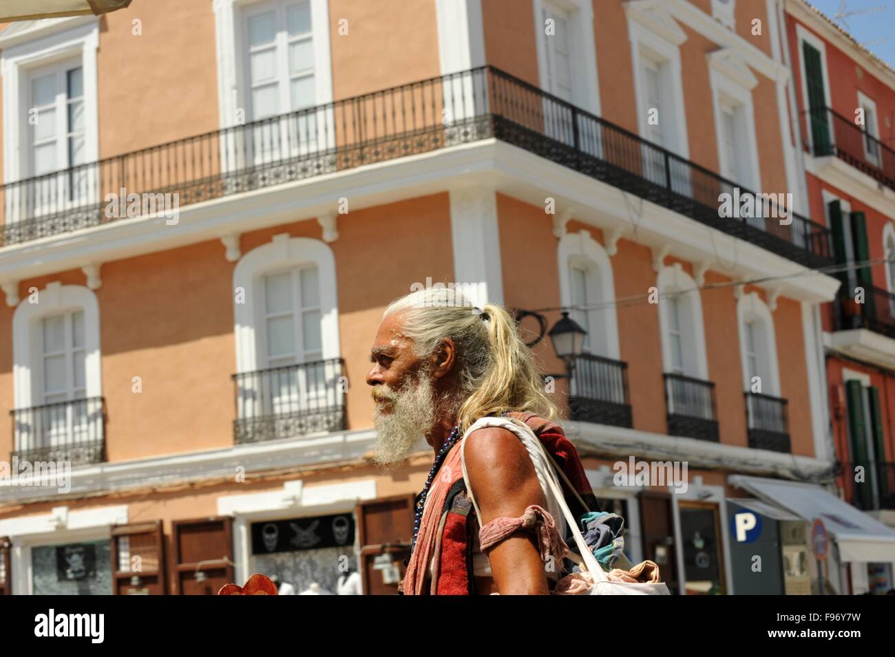 Old Hippy in Ibiza town Stock Photo