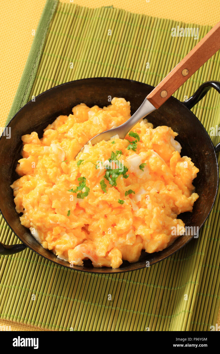 Scrambled eggs in a skillet Stock Photo - Alamy
