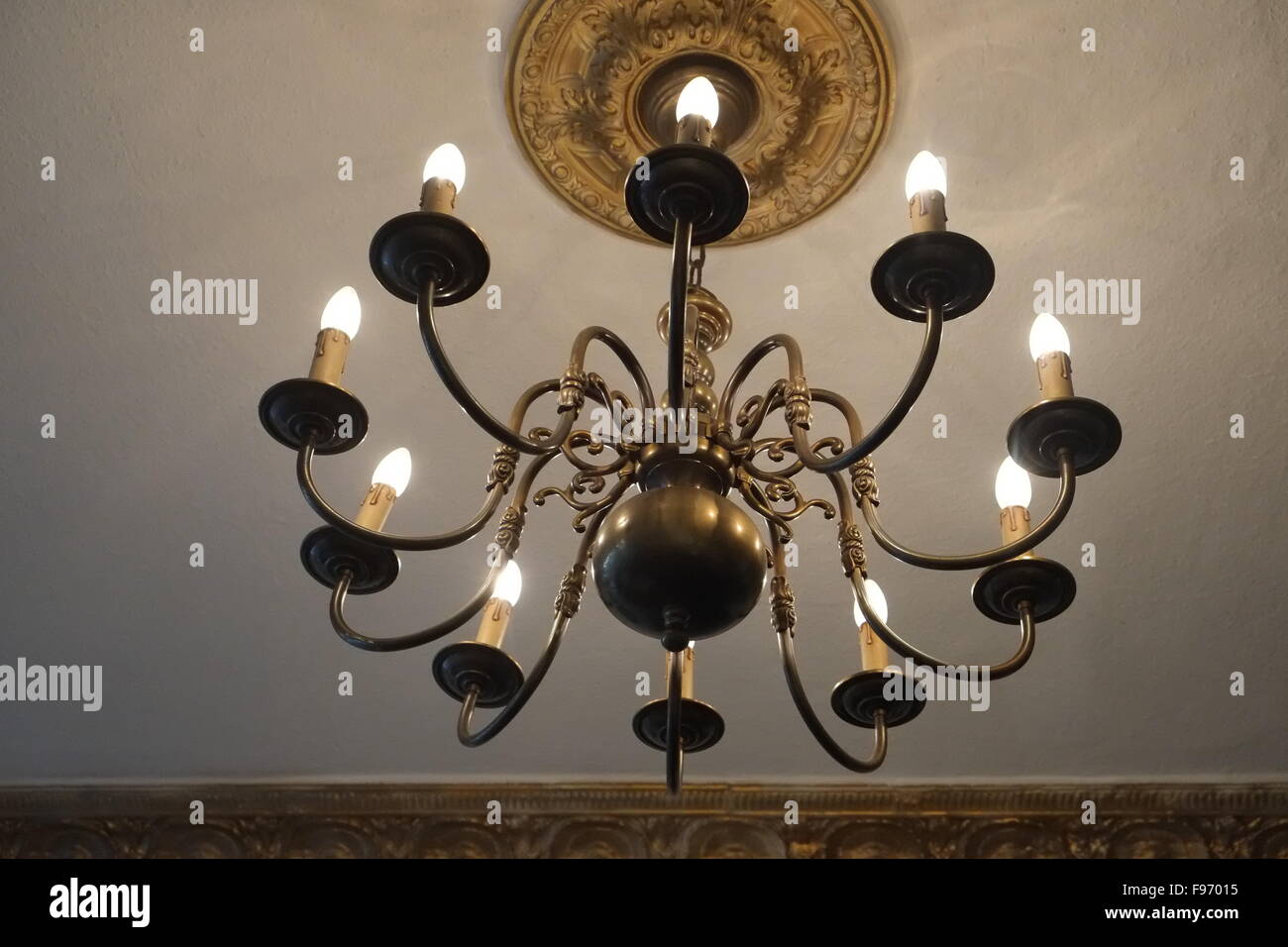Chandelier With Light Bulbs Projecting Light Stock Photo