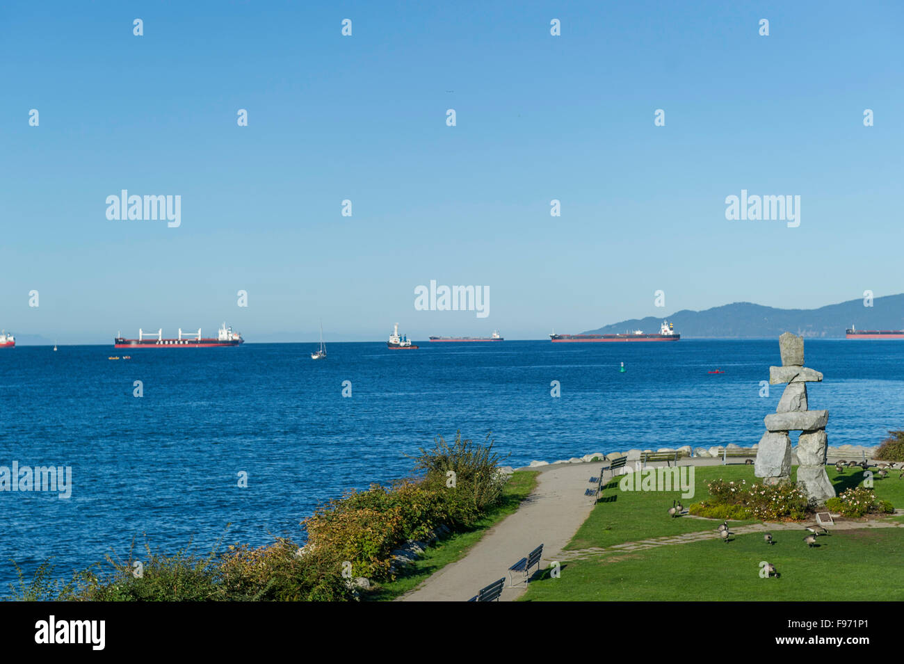 The English Bay Inukshuk is a popular attraction. Located off the popular Vancouver Seawall, Vancouver art piece and it was the Stock Photo