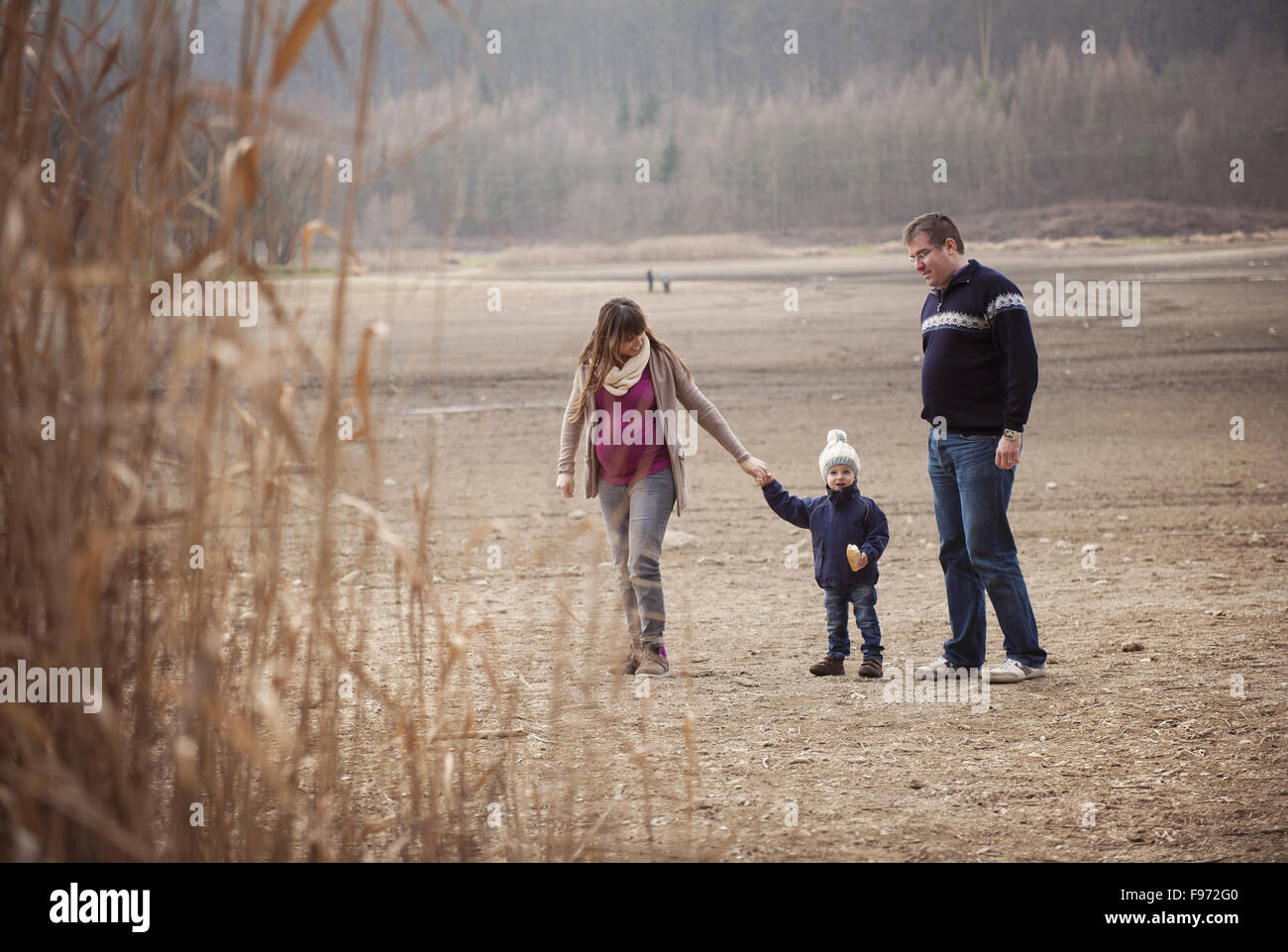 Happy young family spending time together in nature. Stock Photo