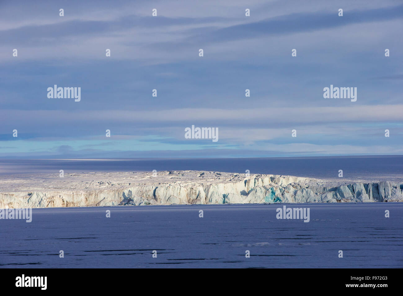 Hochstetterbreen, a glacier south of Hinlopen Strait, with heavy pack ice, Svalbard Archipelago, Arctic Norway. Stock Photo