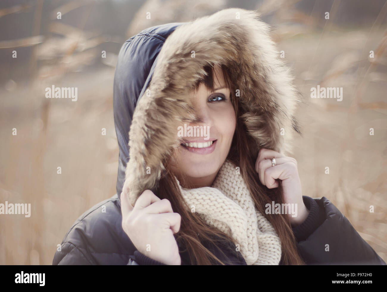 Portrait of woman with hood on in autumn country Stock Photo