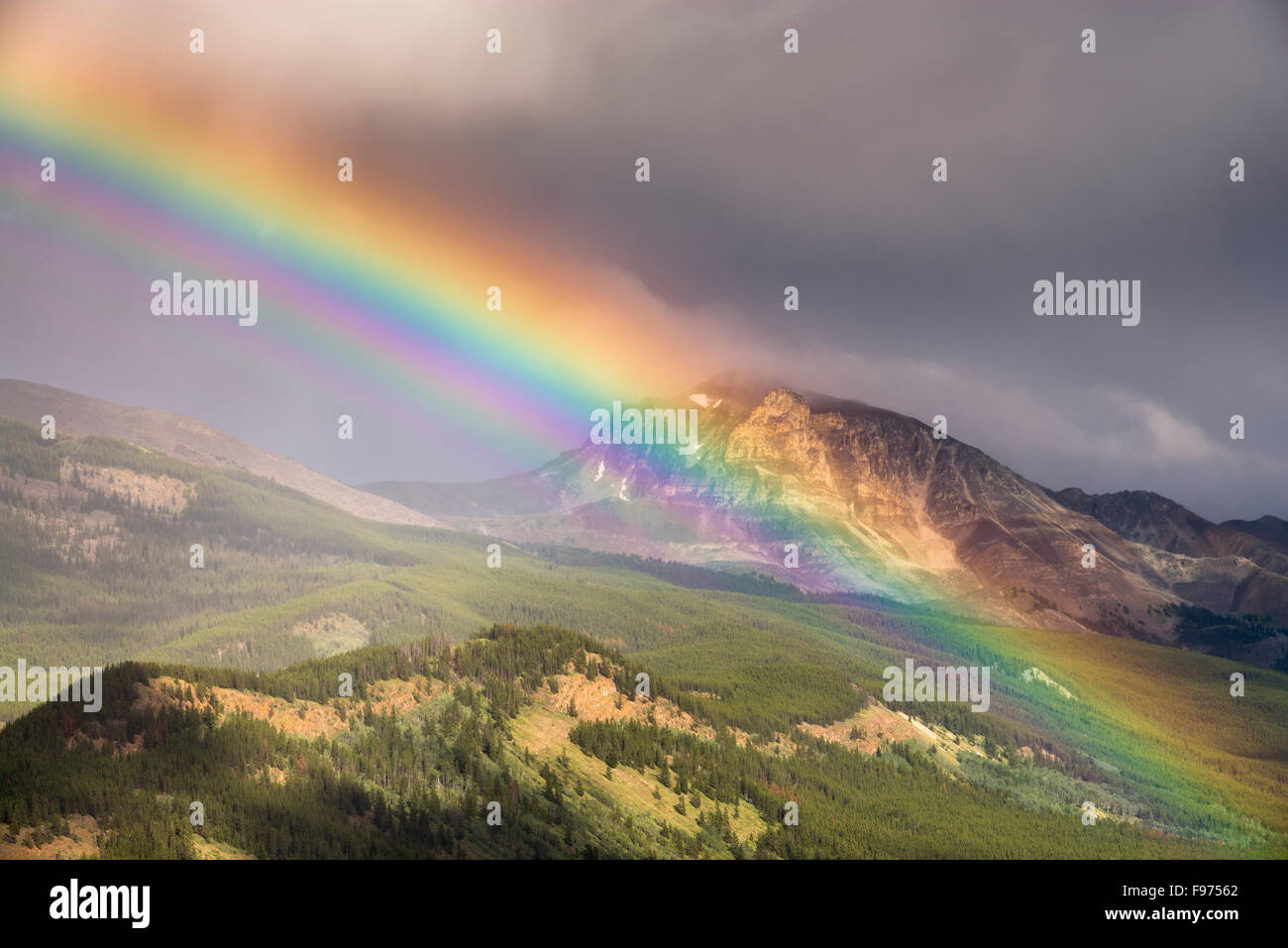 Rainbow in the mountains in Jasper National Park, Alberta, Canada. Stock Photo