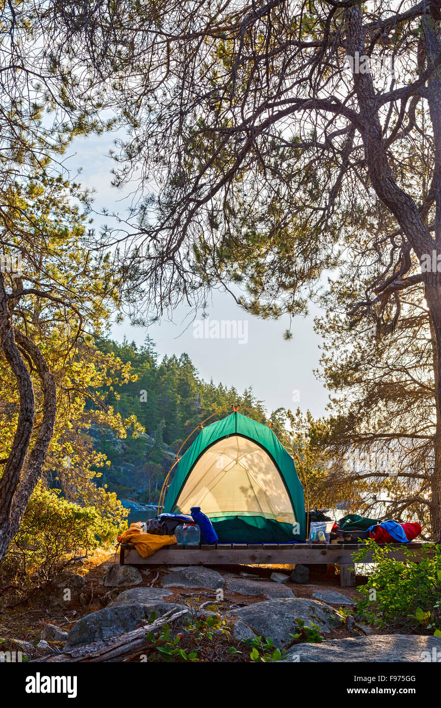 A kayaker's tent on West Curme Island overlooks  Mink Island in Desolation Sound Marine Park, British Columbia, Canada. Stock Photo