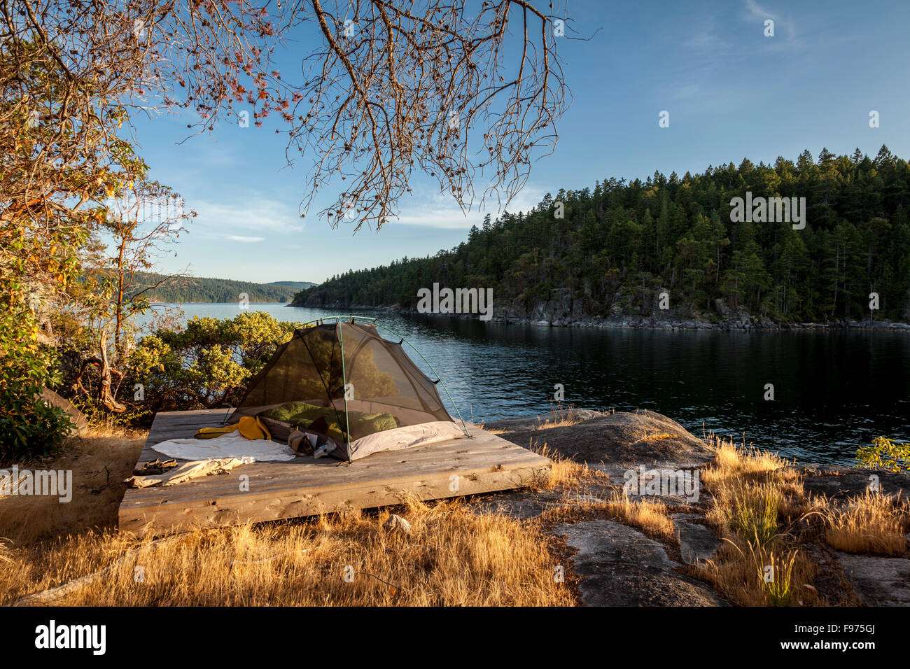 A kayaker's tent on West Curme Island overlooks  Mink Island. Desolation Sound Marine Park, British Columbia, Canada. Stock Photo