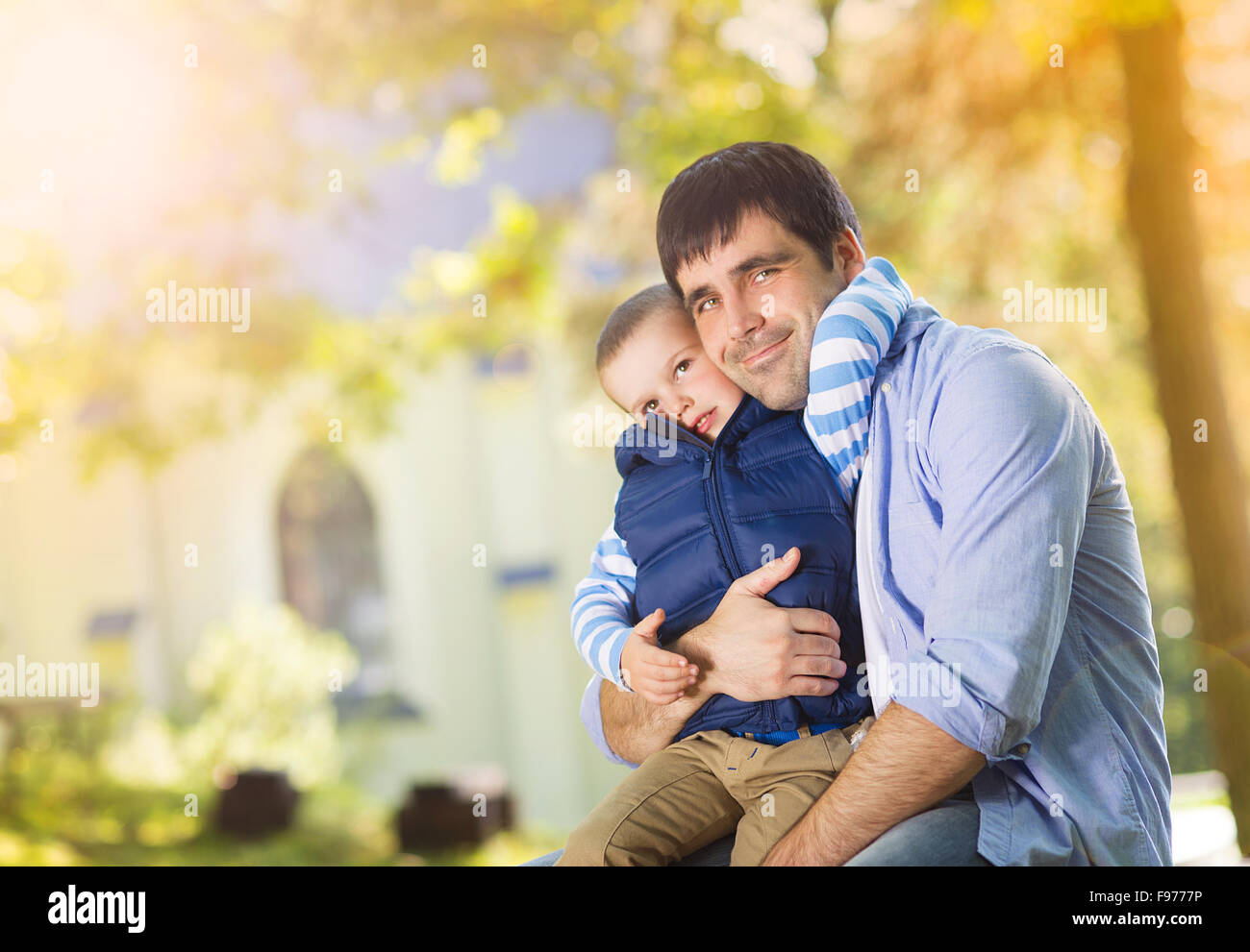 Father and son spending time together in summer nature Stock Photo