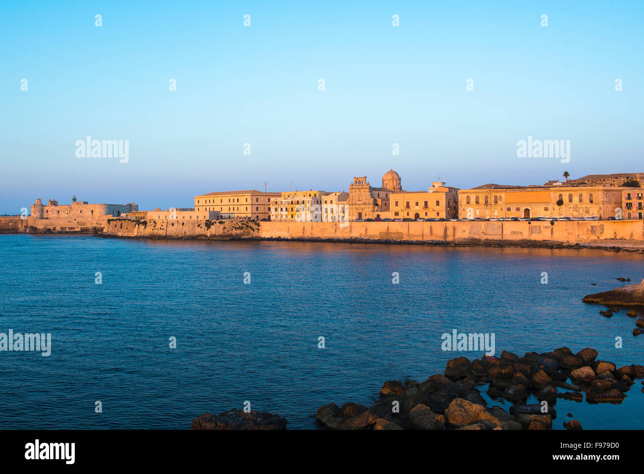 Sicily coast sunset, a view of the eastern sea wall and skyline of the
