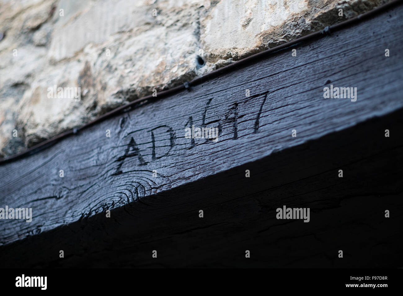 the-date-year-ad-1647-carved-into-a-door-frame-of-an-old-historical-F97D8R.jpg