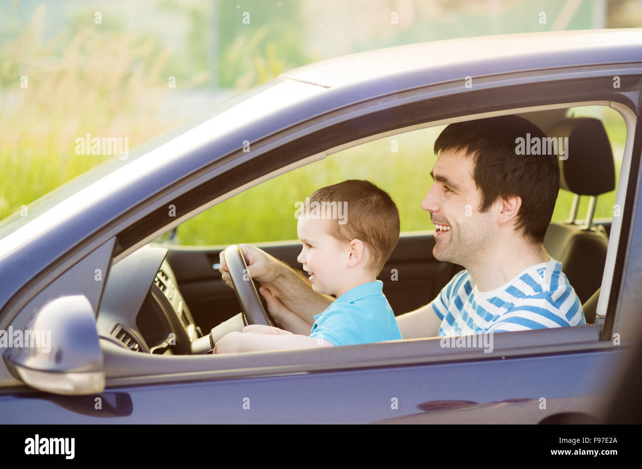 Young father with his little son driving car together Stock Photo - Alamy