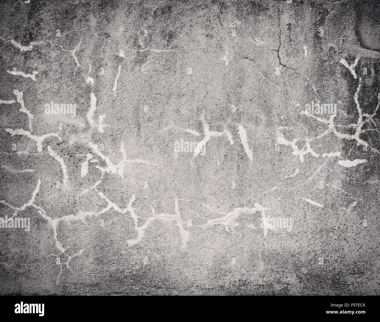 Dark cracked concrete wall texture with vignette Stock Photo