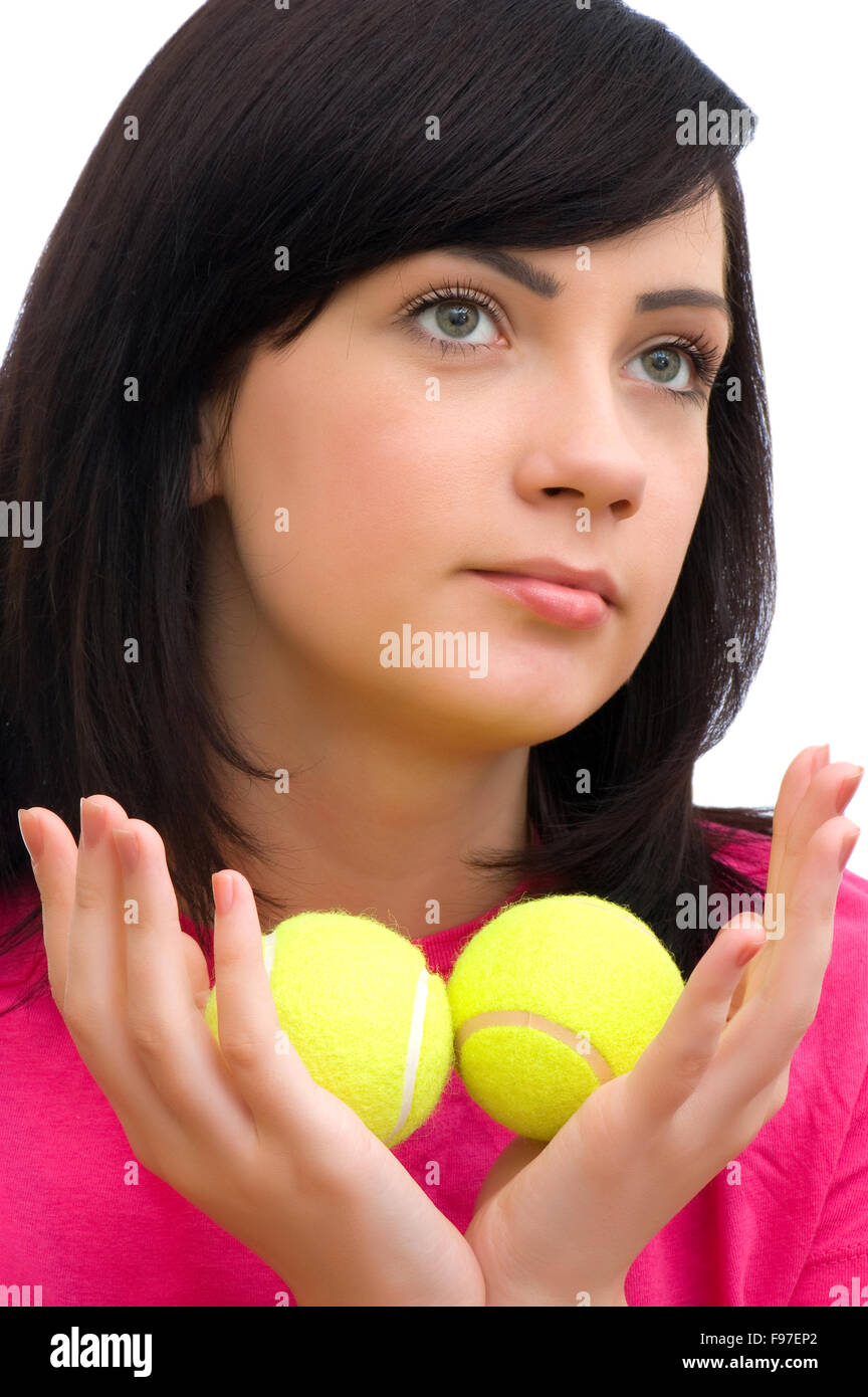 Girl holding two tennis balls on white Stock Photo Alamy