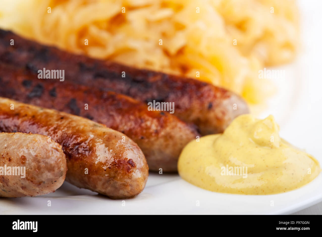 fried sausages,mustard and sauerkraut Stock Photo Alamy
