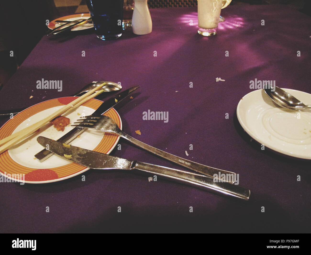 Plates And Cutlery After Meal Stock Photo Alamy