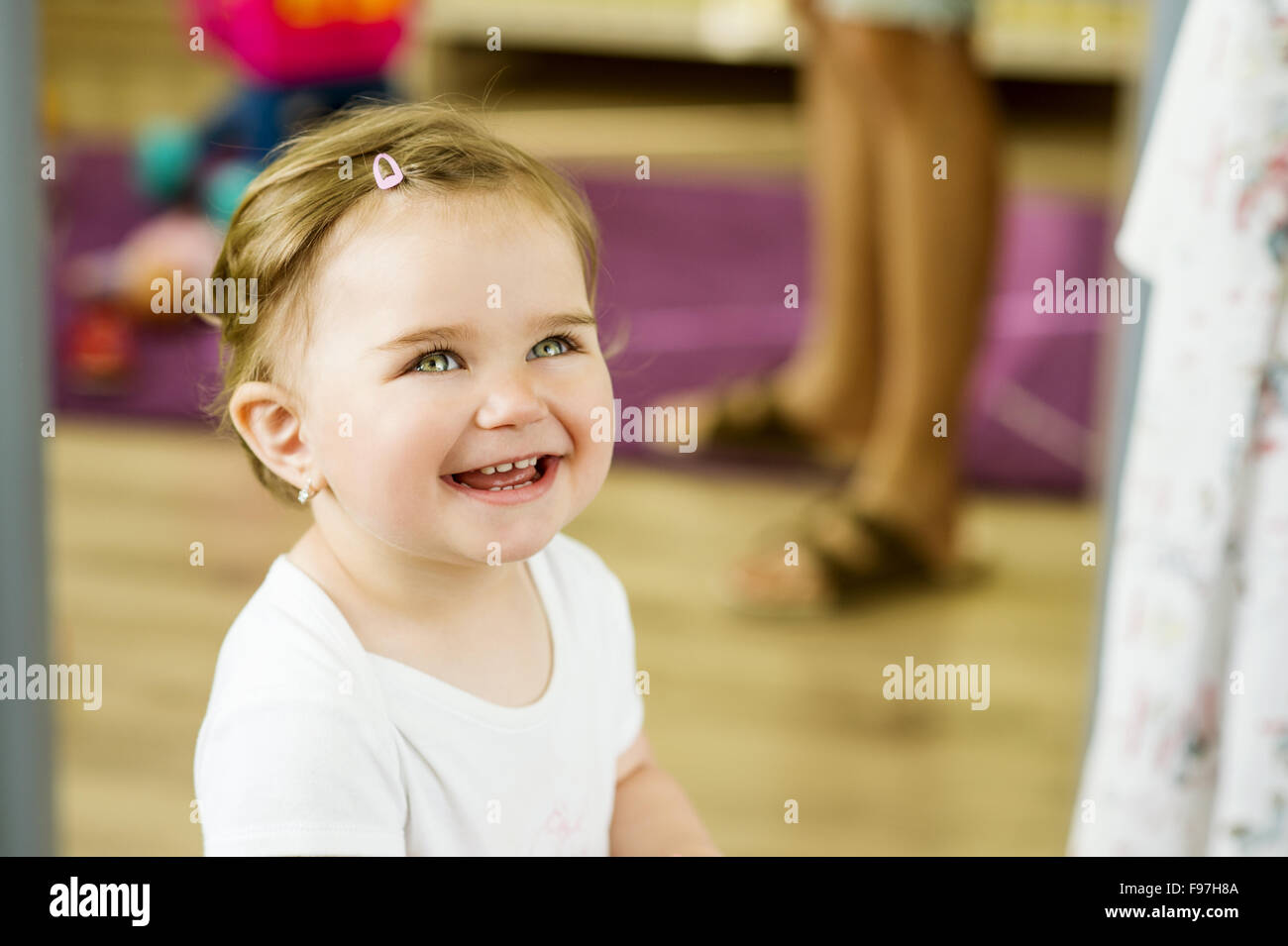 Indoor portrait of cute little girl smiling Stock Photo - Alamy