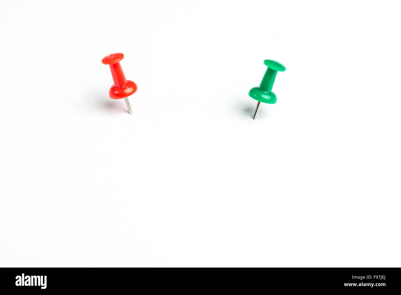 2 colored pins on a white background Stock Photo