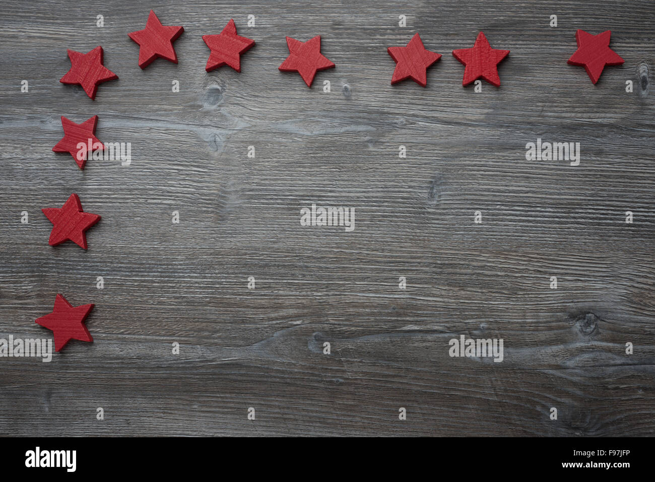 Wood background isolated with red stars Stock Photo