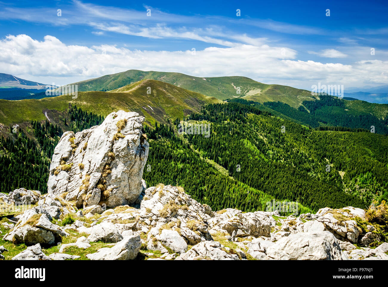 Carpathian Mountains Range, Romania. Amazing cloudy summer scenery with Bucegi Mountains in Brasov county, ridge by dolomite roc Stock Photo