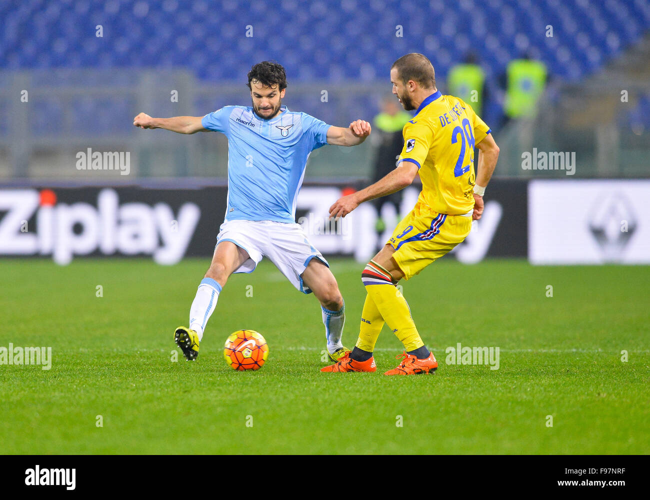 Rome, Italy. 14th December, 2015. Marco Parolo fights for the ball with Lorenzo De Silvestri during the Italian Serie A football match S.S. Lazio vs U.C. Sampdoria at the Olympic Stadium in Rome, on December 14, 2015. Stock Photo