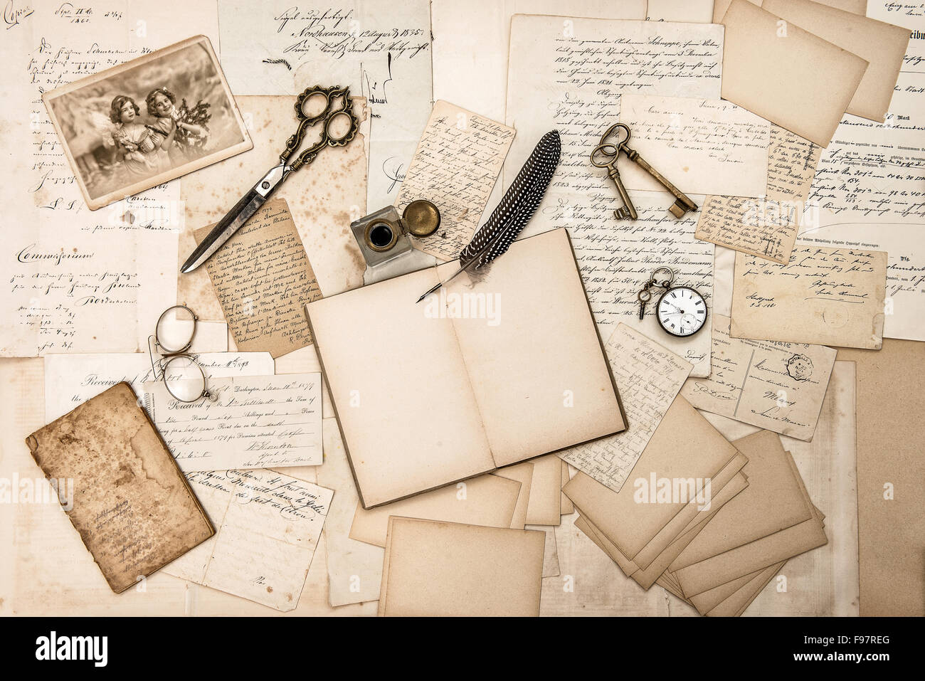 Old handwritten letters, pictures and antique writing accessories. Nostalgic sentimental paper background Stock Photo