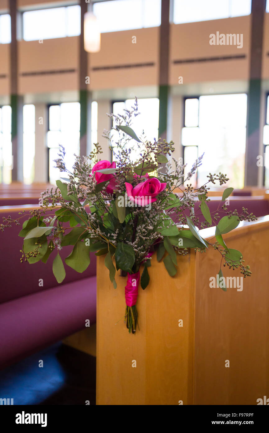 Flower bouquet at a wedding ceremony inside a Catholic church Stock Photo Alamy