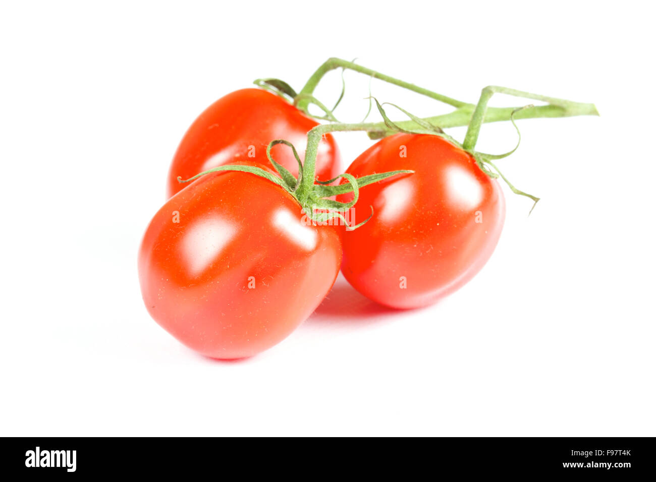 cherry tomatoes isolated on a white background Stock Photo - Alamy