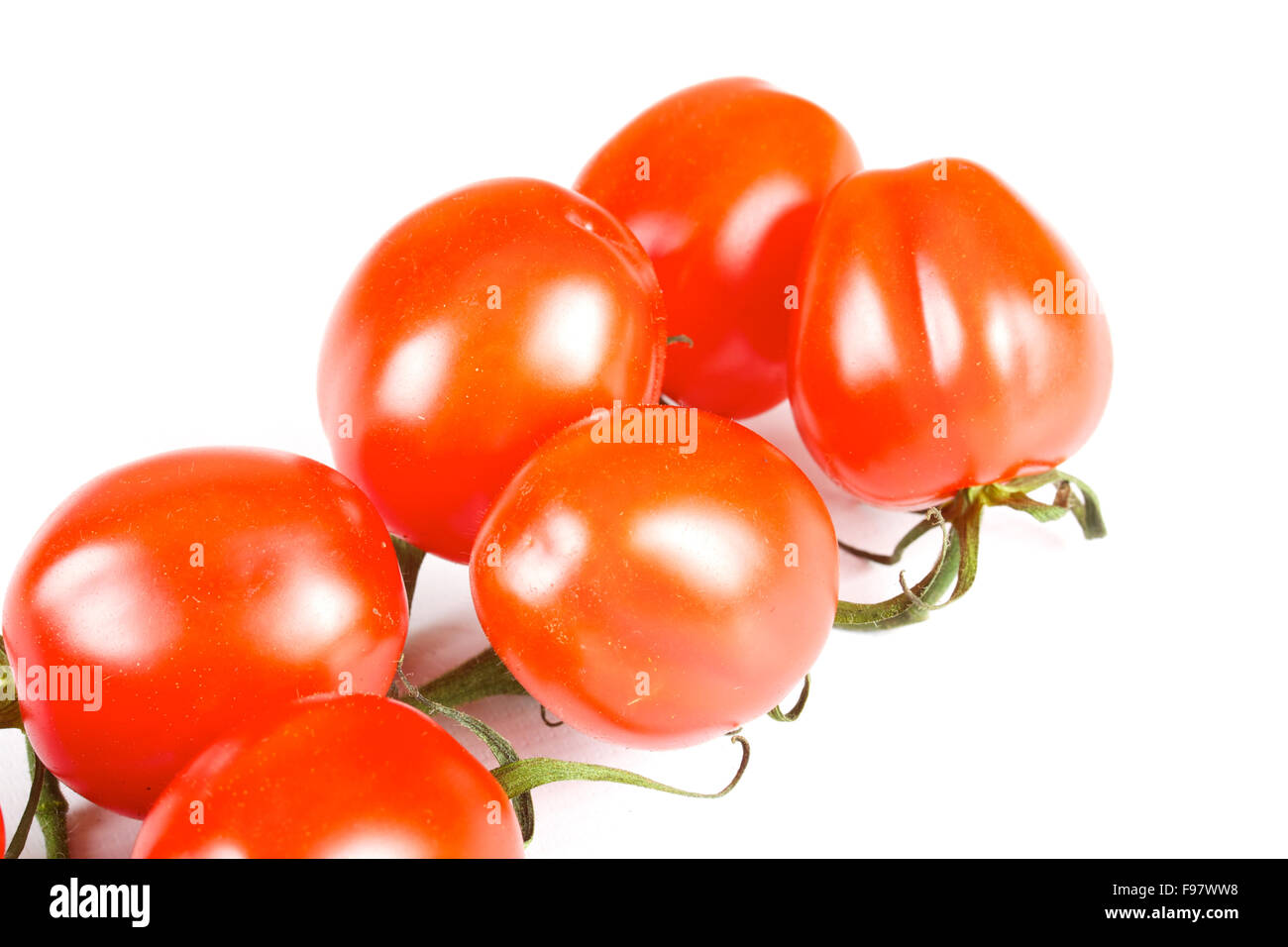 cherry tomatoes isolated on a white background Stock Photo - Alamy