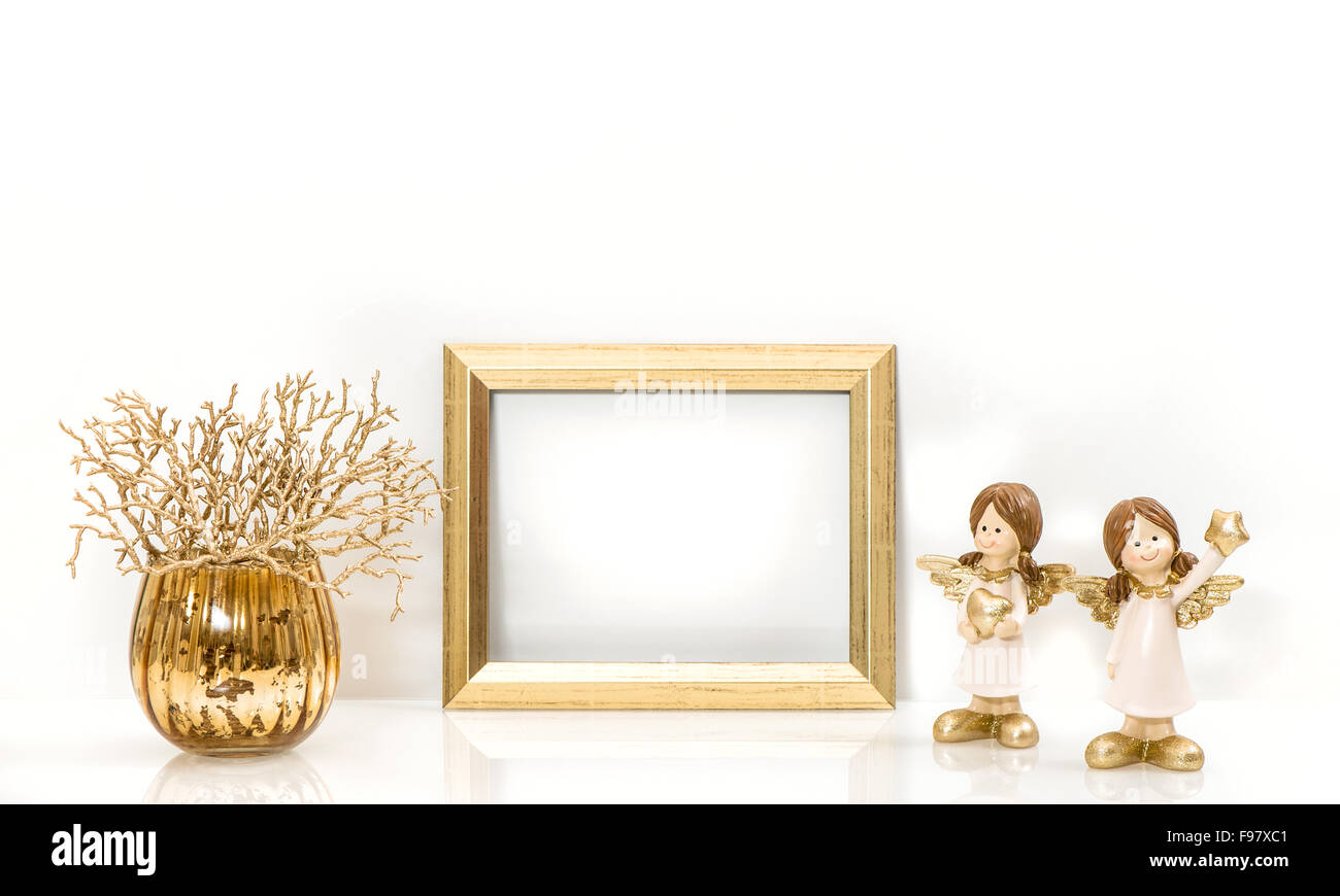 Golden frame and Christmas decorations Angel. Mock up with space for your picture or text Stock Photo