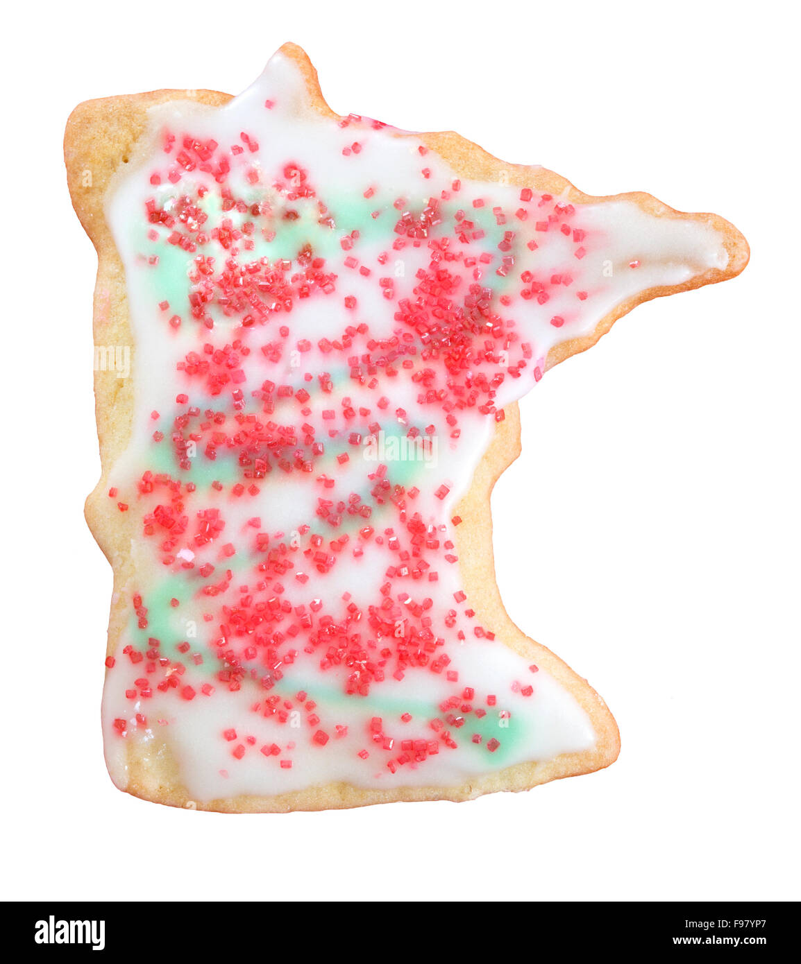 A holiday sugar cookie shaped like the US state of Minnesota with frosting and sugar sprinkles Stock Photo
