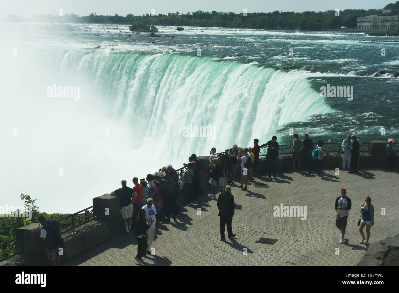Tourists at the rail. Canadian Falls. Horseshoe Falls. Niagara Falls, Ontario, Canada. Stock Photo