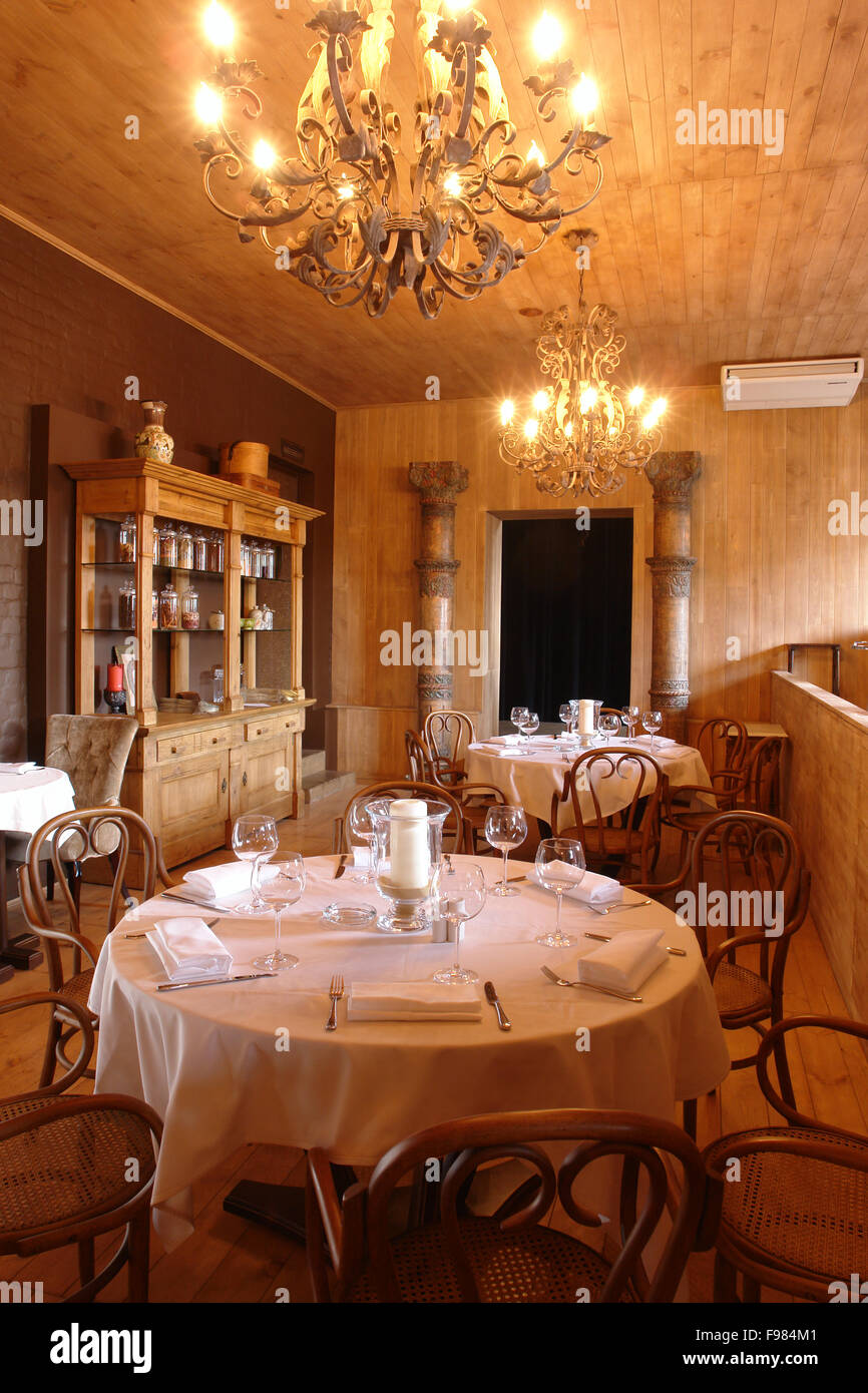 table in restaurant with full tableware Stock Photo - Alamy
