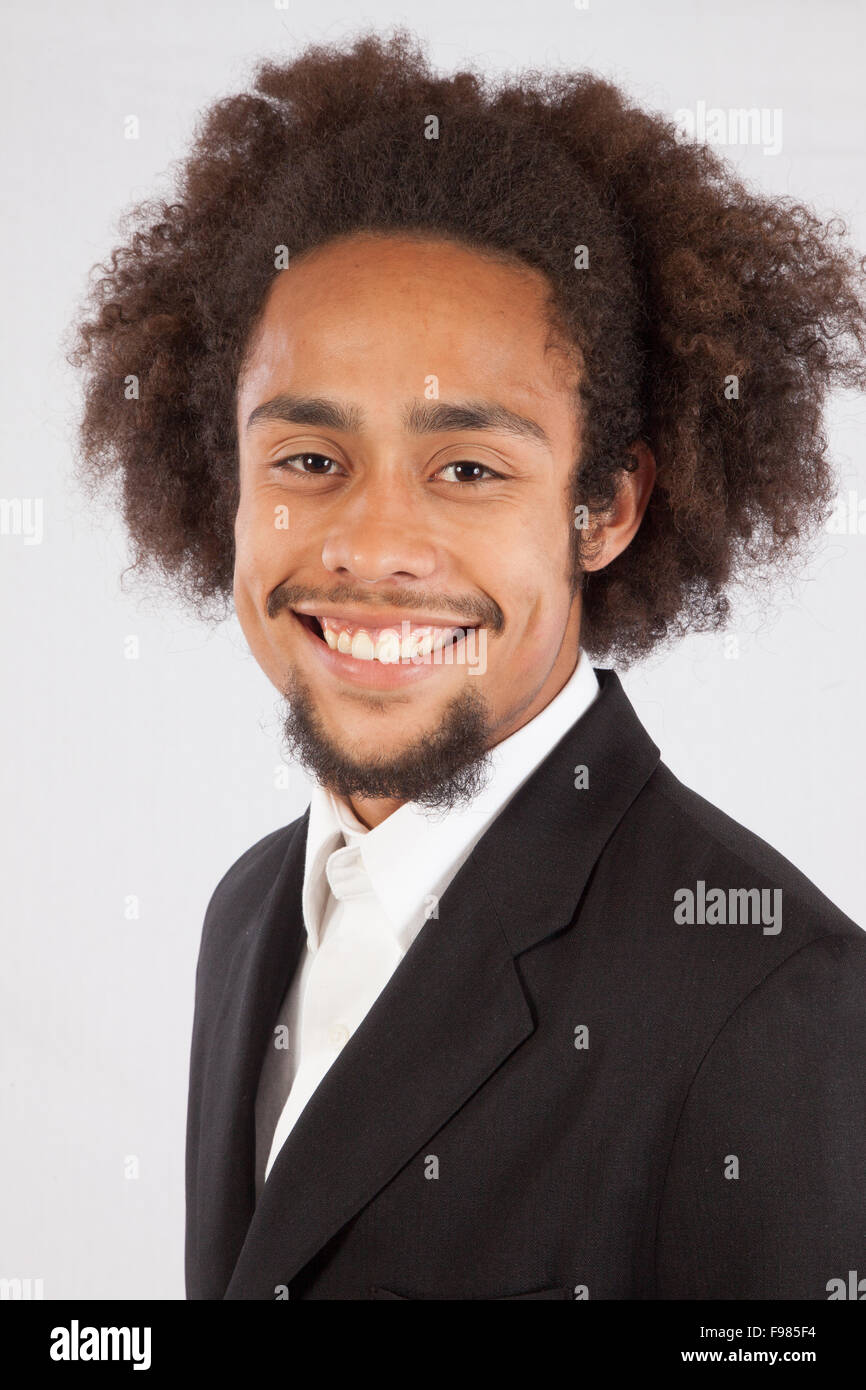 Handsome black man in suit coat with a pleased smile Stock Photo