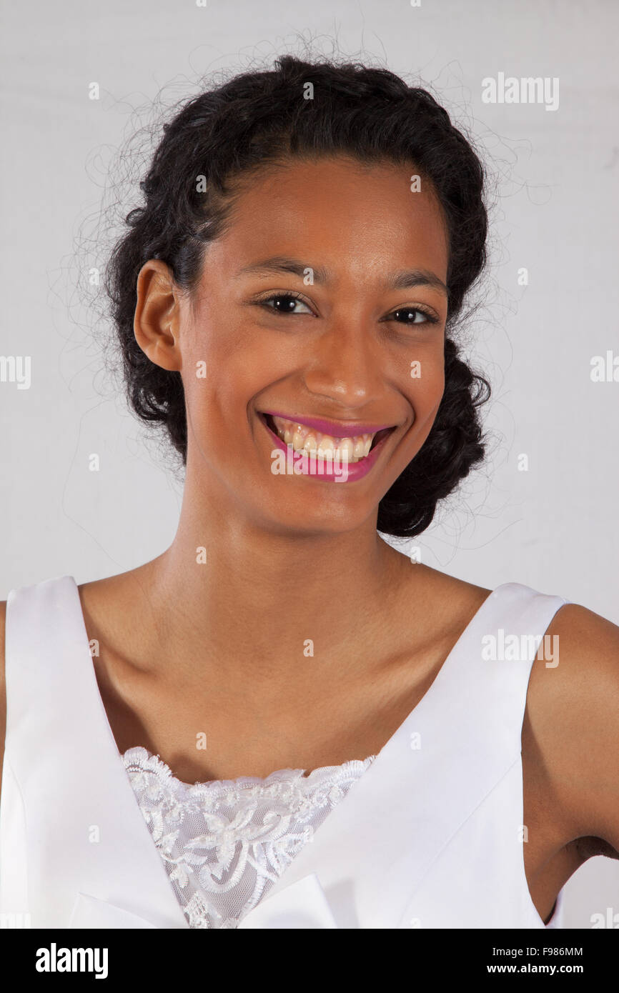 Pretty black woman, dressed as a bride, smiling broadly Stock Photo