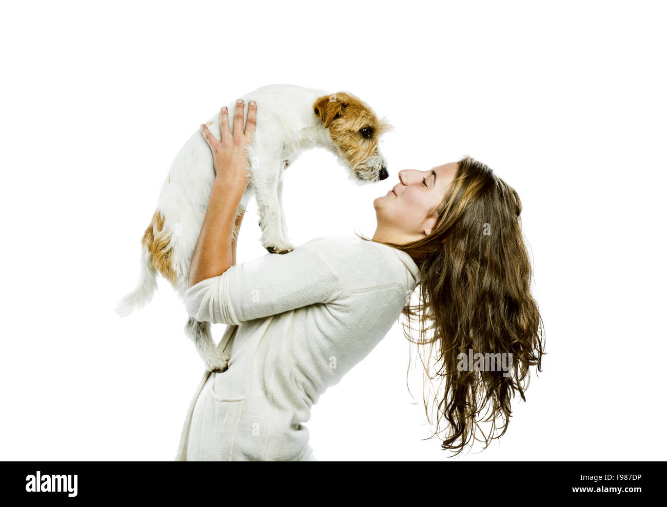 Young woman holding her cute parson russell terrier dog isolated on white background Stock Photo