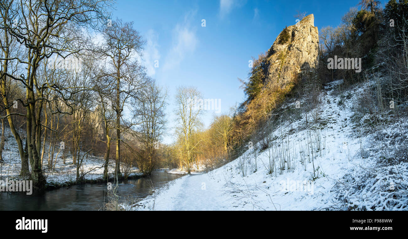 River flowing through snow covered Winter landscape in valley Stock ...