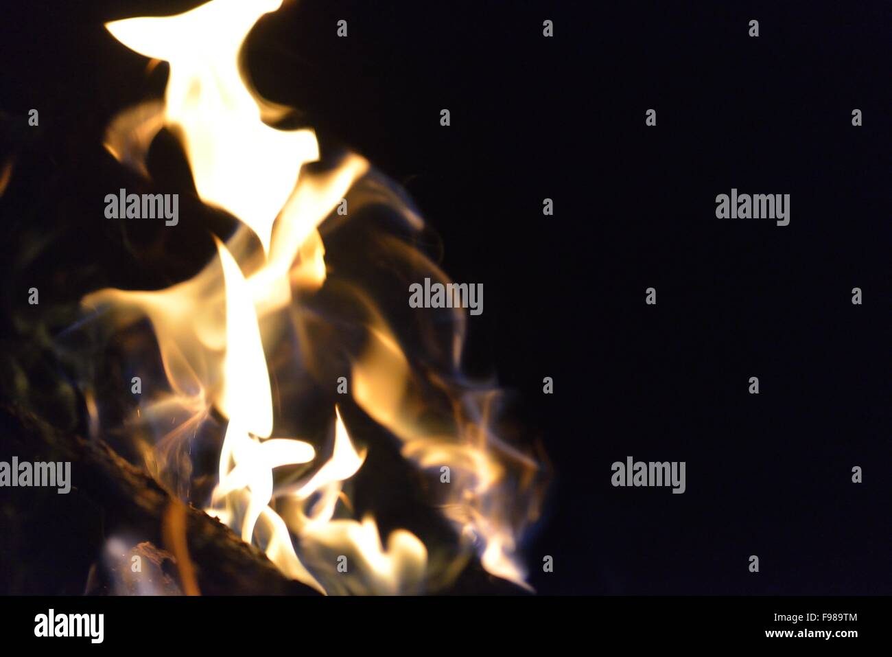 Fire flames design isoleted on black background Stock Photo - Alamy
