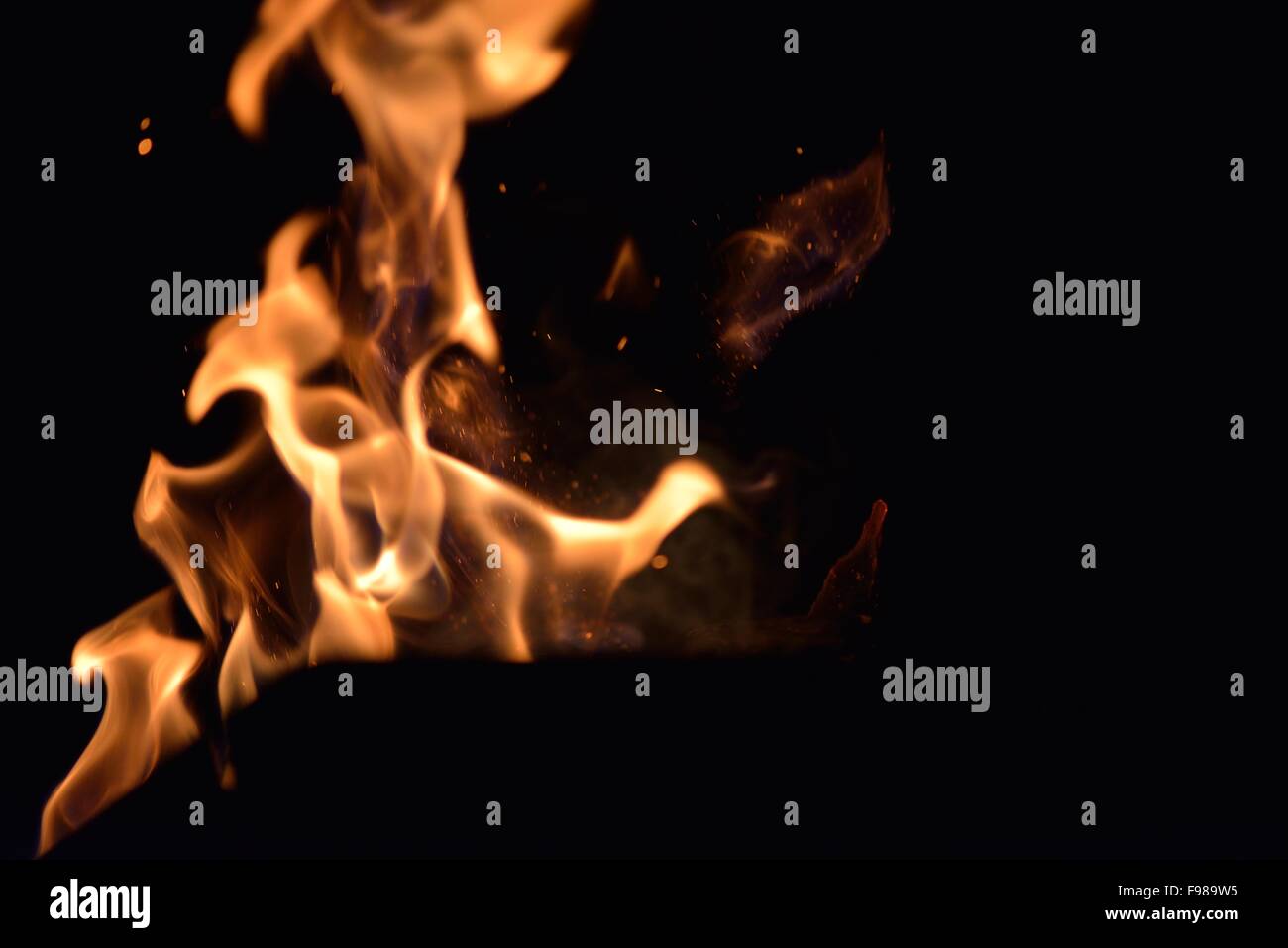 Fire flames design isoleted on black background Stock Photo - Alamy
