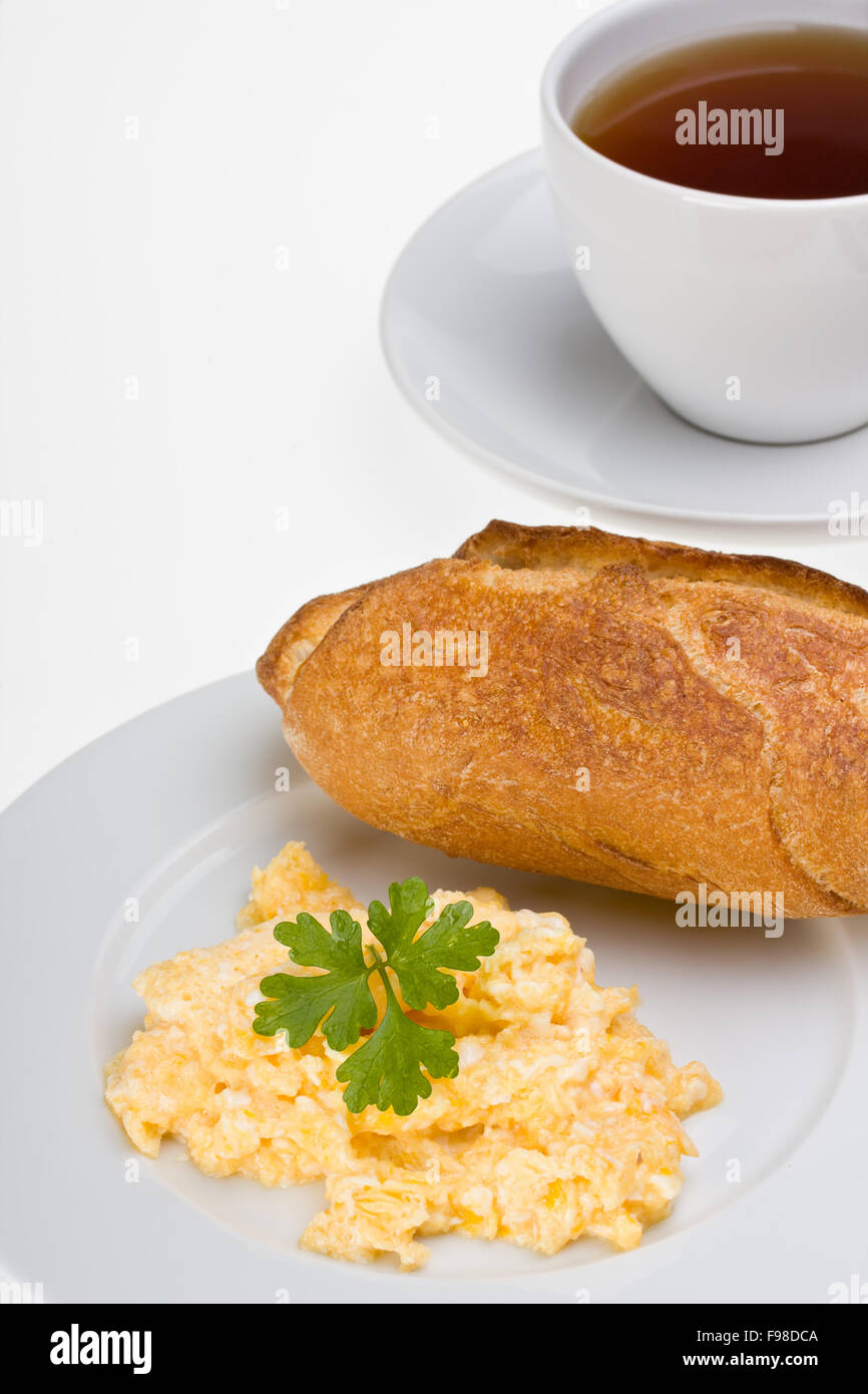scrambled eggs and bun on a plate Stock Photo - Alamy
