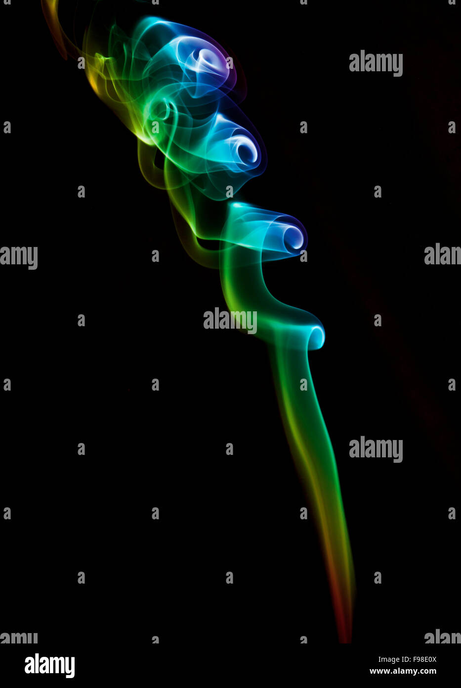 Fume of a incense stick, black background Stock Photo