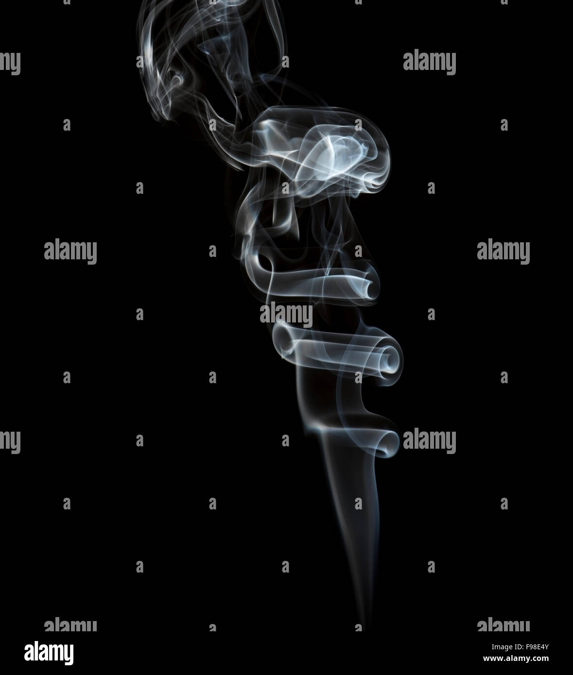 Fume of a incense stick, black background Stock Photo