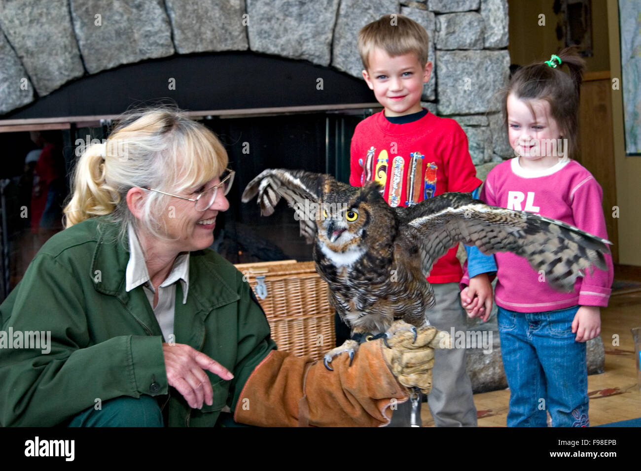 A park ranger shows off a horned owl to young enthusiasts at Amicalola Falls State Park in North Georgia. Stock Photo