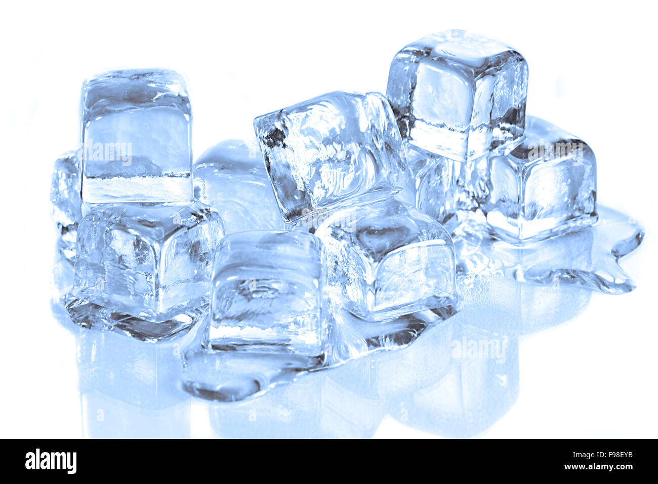 Cool Ice Cubes Melting on a White Reflective Surface Stock Photo - Alamy