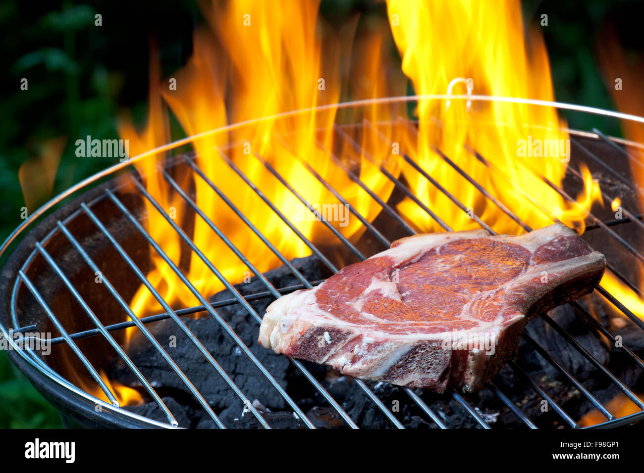 t bone steak on a grill outdoors Stock Photo Alamy