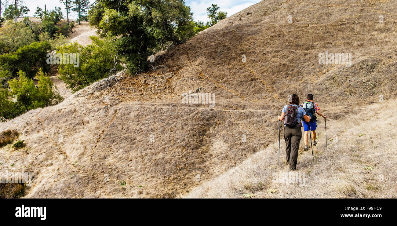Rear view of two sisters out for a day hike Stock Photo - Alamy