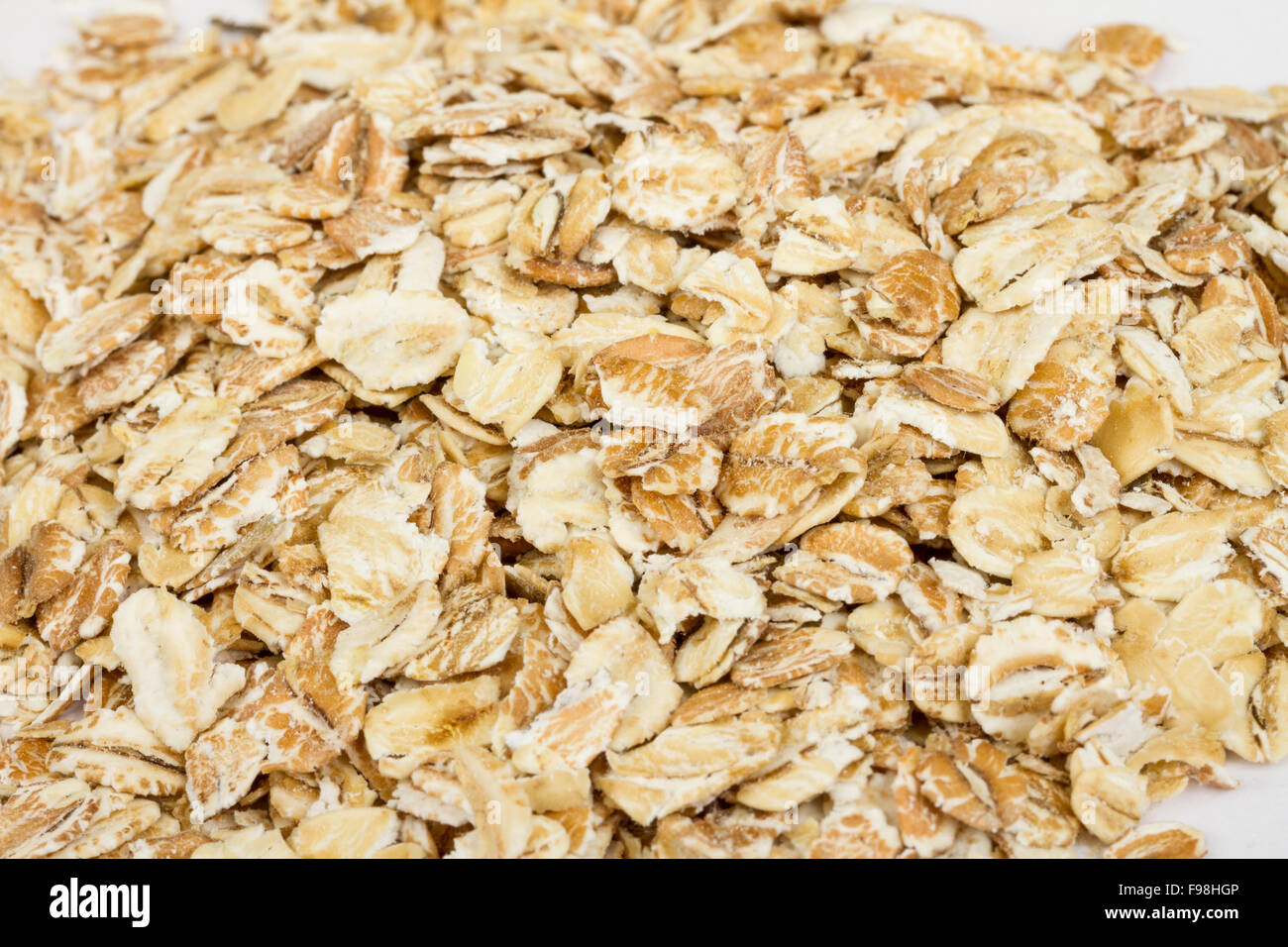 Heap of dry rolled oats isolated on white background Stock Photo Alamy