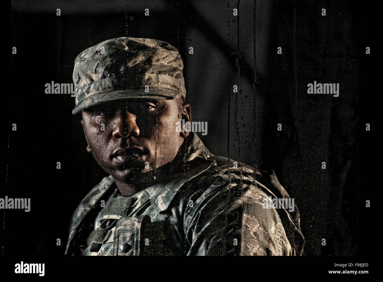 Air Force Security Forces member secures the stairwell of a building during clearing operations training. Stock Photo